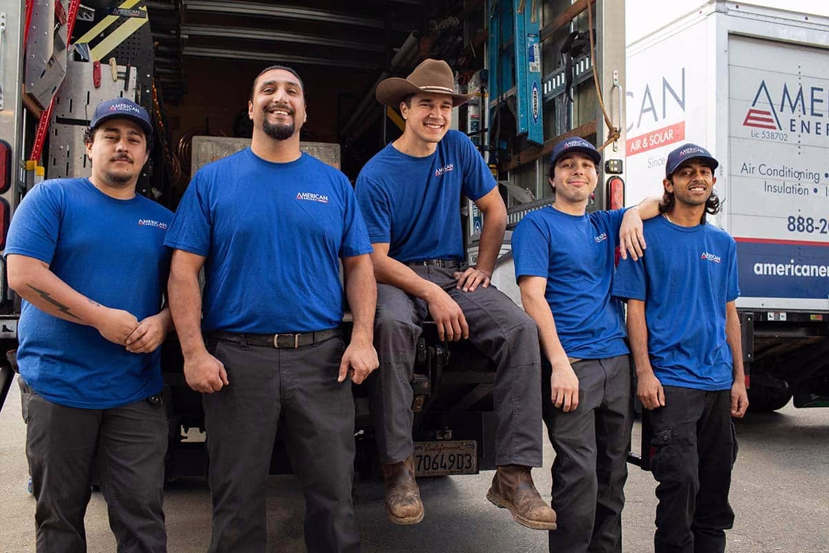 American Energy installation crew gathered at the back of a company service truck