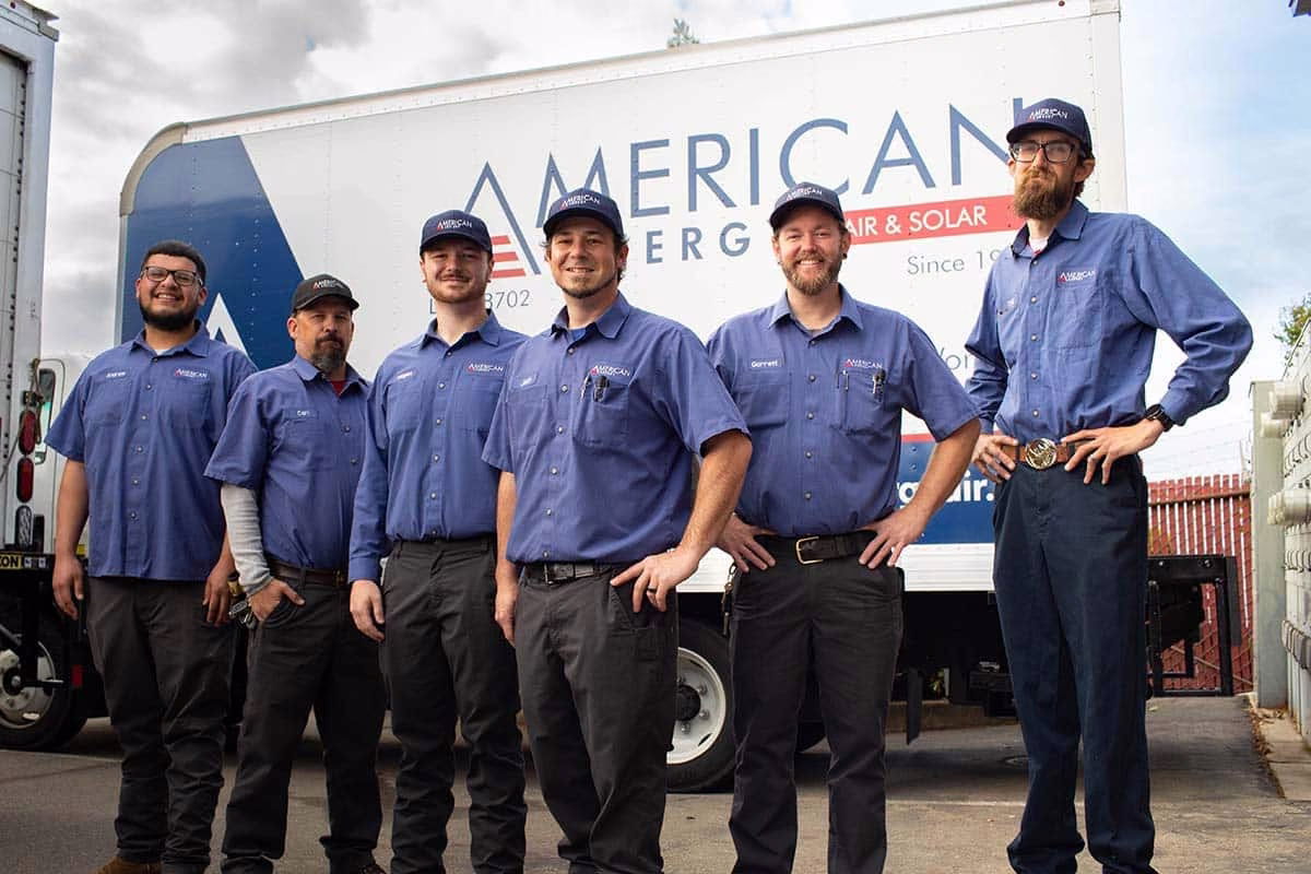 Five American Energy service technicians standing in front of a branded box truck